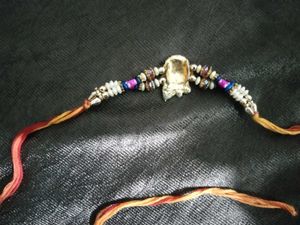 Elegant Rakhi with Red Pearls