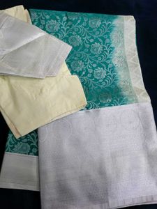 Elegant Teal Saree with Silver Floral Motifs