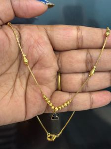 Elegant Gold Necklace with Black Pendant