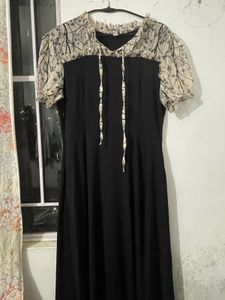 Elegant Black Dress with Printed Sleeves