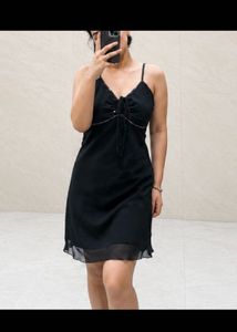 Chic Black Slip Dress with Embellished Neckline
