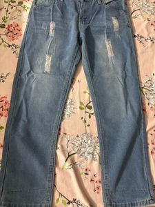 Distressed Light Wash Denim Jeans