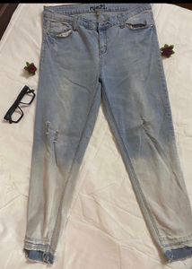 Distressed Light Wash Denim Jeans