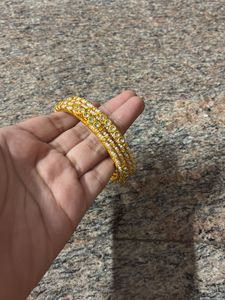 Elegant Gold Tone Bangle Set with Stones