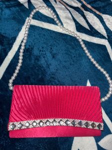 Elegant Pink Clutch with Pearl Strap