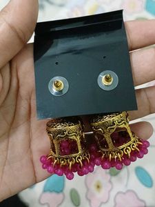 Elegant Gold Tone Jhumka Earrings with Pink Beads