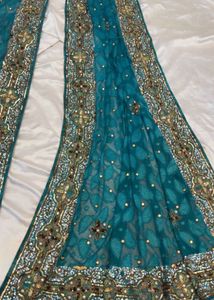Exquisite Embellished Teal Saree