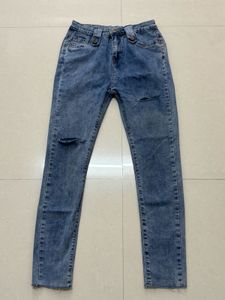 Distressed Blue Denim Jeans