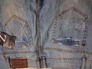 Distressed Blue Denim Jeans