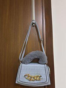 :Elegant blue Quilted Sling Bag with Faux Fur Hand