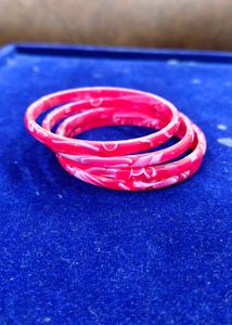 Vibrant Red Bangles with White Swirls