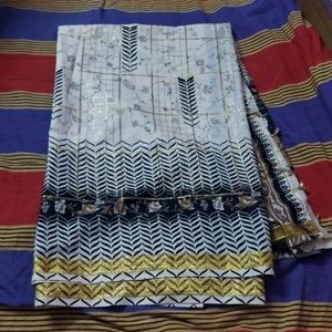 beautiful checked cream saree with black print border