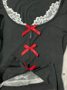 Chic Black Long Sleeve Top with Red Bows