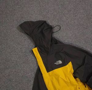 THE NORTH FACE YELLOW AND BLACK JACKET