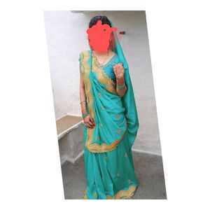 Elegant Teal Saree with Gold Embroidery