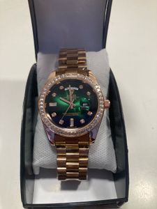 Rose Gold Rolex Watch with Green Dial