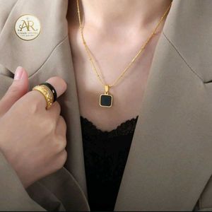 Elegant Gold Chain with Black Pendant