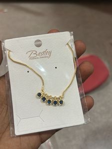 Elegant Gold Necklace with Blue Stones