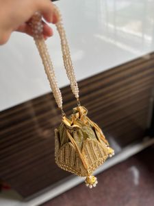 Elegant Gold Embellished Potli Bag