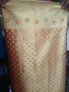 Beautiful Golden tissue saree with blouse piece