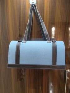 Stylish Blue Handbag with Brown Trim