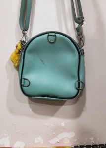 Cute Teal Crossbody Bag with Charm and keychain.
