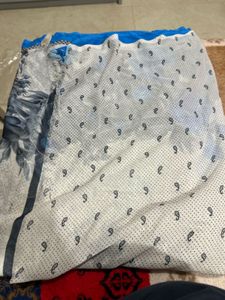 White saree with blue floral design beautifully ca