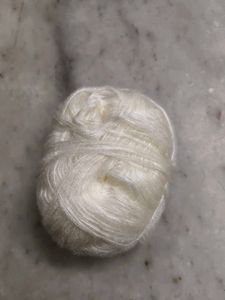 Assorted Yarn Balls and Crochet Hook