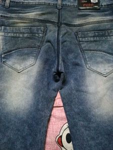 Distressed Blue Denim Jeans