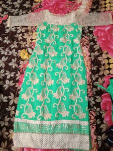 Green Ethenic Suit For Celebrations