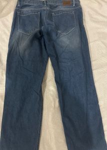 Distressed Blue Denim Jeans