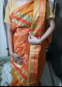 Vibrant Orange Saree with Green Border