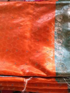 Vibrant Orange Saree with Blue &amp; Silver Border