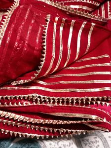 Elegant Red Saree with Gold Embellishments