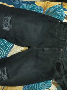 Black Distressed bootcut Jeans with hem