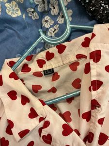 Adorable white button-up shirt with hearts