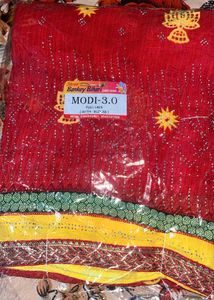 Vibrant Red Saree with Yellow Embellishments