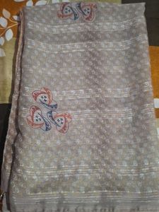 Elegant Beige Saree with Intricate Pattern