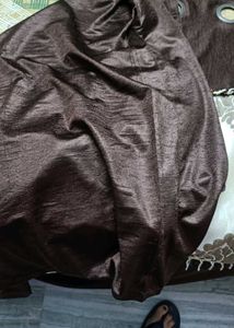 Gray V-Neck Knit Sweater and curtain