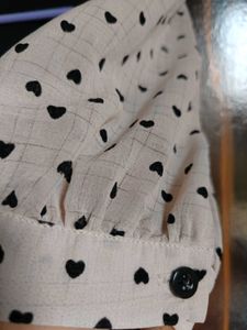 Chic Black Dress with Heart Print Sleeves
