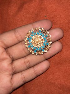 stylish indian earing with a pearl choker and ring