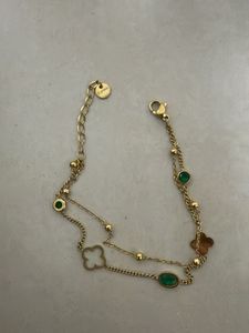 Elegant Gold Bracelet with Emerald Accents