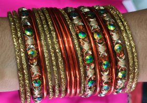 Orange And Golden Colour Bangles