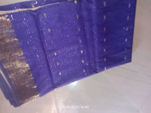 a purple saree with silver dotted design