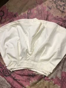 Cream High-Waisted Pleated Shorts
