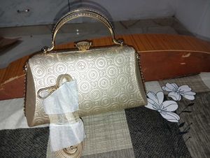 Elegant Gold Embossed Clutch Bag
