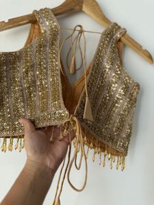 Embellished V-Neck Sleeveless Blouse