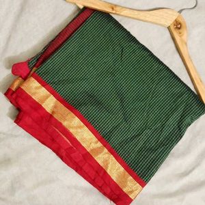 Elegant Green Saree with Red Border