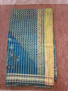 Teal Saree with Gold Print ,without blouse.