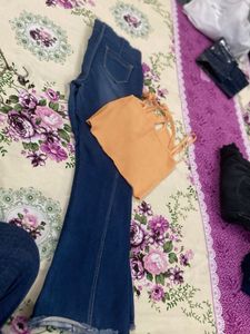 Blue Flared Jeans with Orange Crop Top